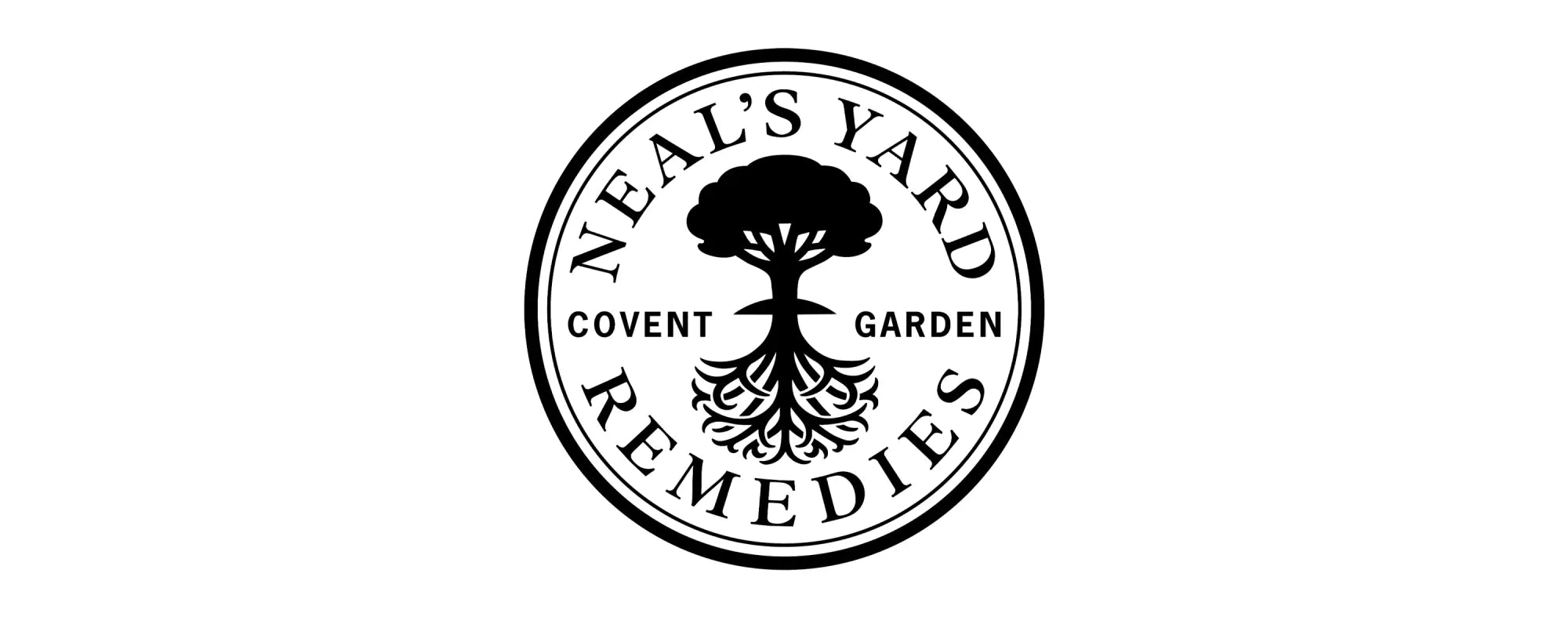 Black circular logo for neal’s yard remedies featuring a stylized tree design in the center
