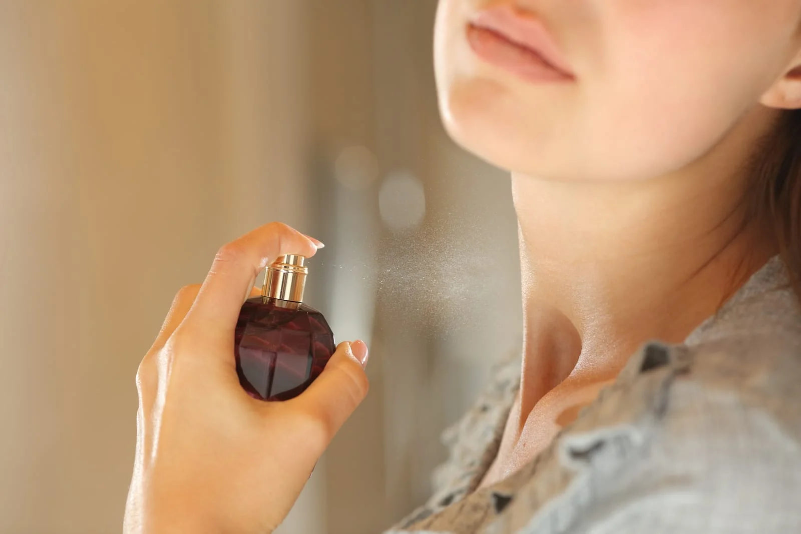 woman applying spring fragrances for women